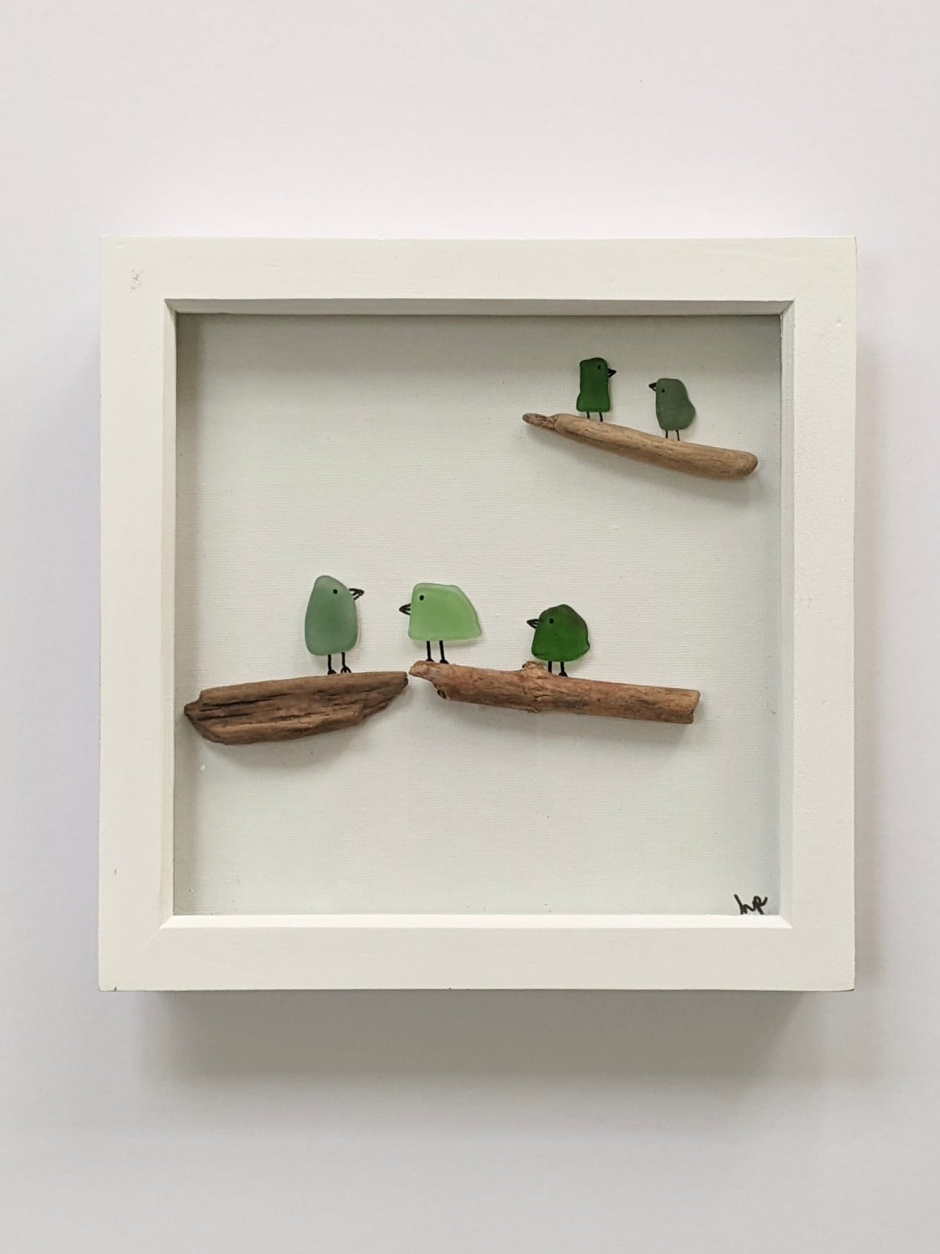 Coastal birds on a branch
